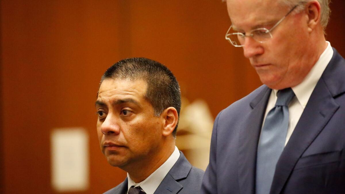 L.A. school board member Ref Rodriguez, left, appears with his attorney, Daniel V. Nixon, for arraignment last month.