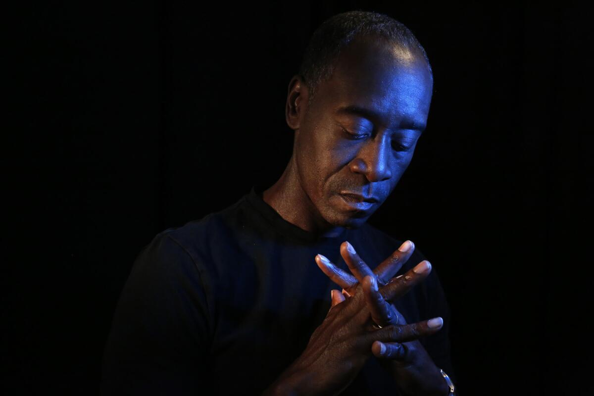 Don Cheadle gets into a "Kind of Blue," feeling while portraying jazz legend Miles Davis in "Miles Ahead."