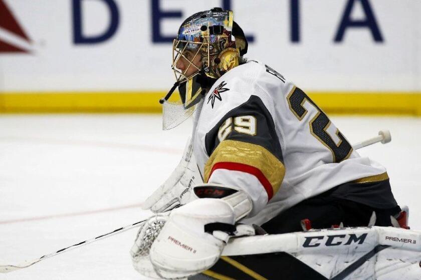 Vegas Golden Knights goaltender Marc-Andre Fleury stretches out during a timeout in the second period of an NHL hockey game against the Los Angeles Kings in Los Angeles, Saturday, Dec. 8, 2018. (AP Photo/Alex Gallardo)