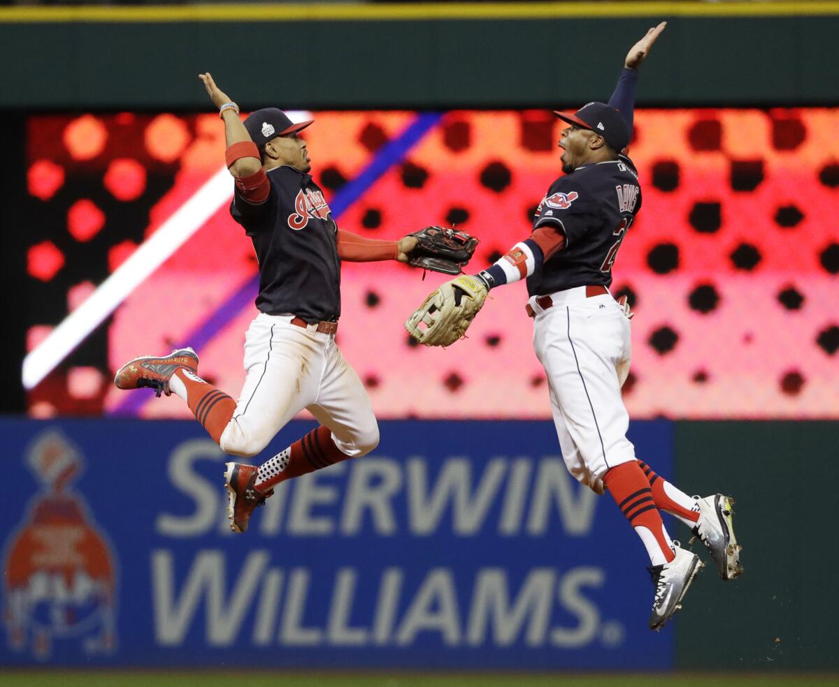 Cleveland's Francisco Lindor, left, and Rajai Davis celebrate after the Indians' 6-0 win over the Chicago Cubs in Game 1 of the World Series.