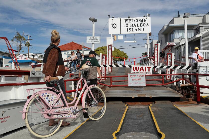 Guests return to Balboa Island on the Balboa Island Ferry on Friday. The ferry will re-open service to autos across Newport Harbor on Saturday morning. The ferry has been shut down to autos due to construction on local streets.