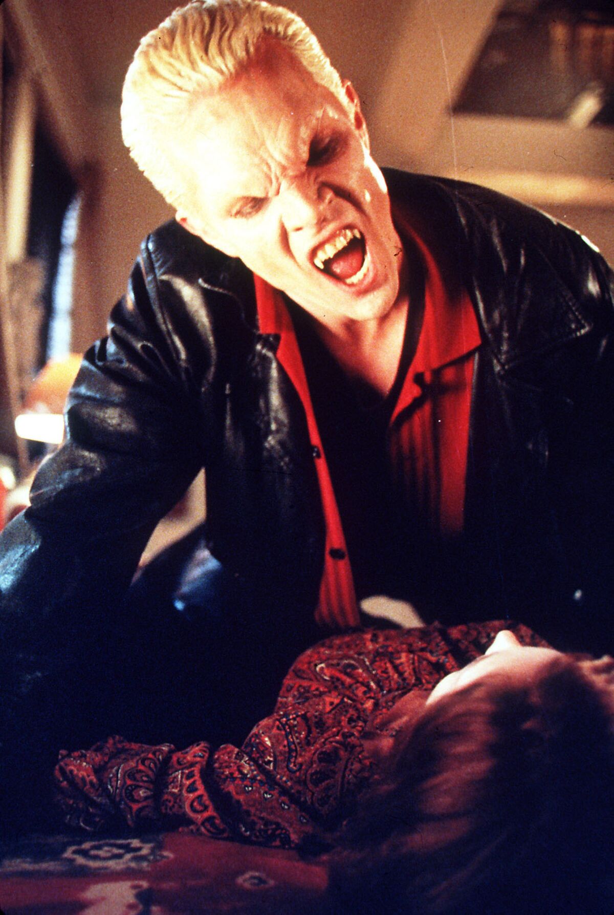 A vampire prepares to take a bite in "Buffy the Vampire Slayer"