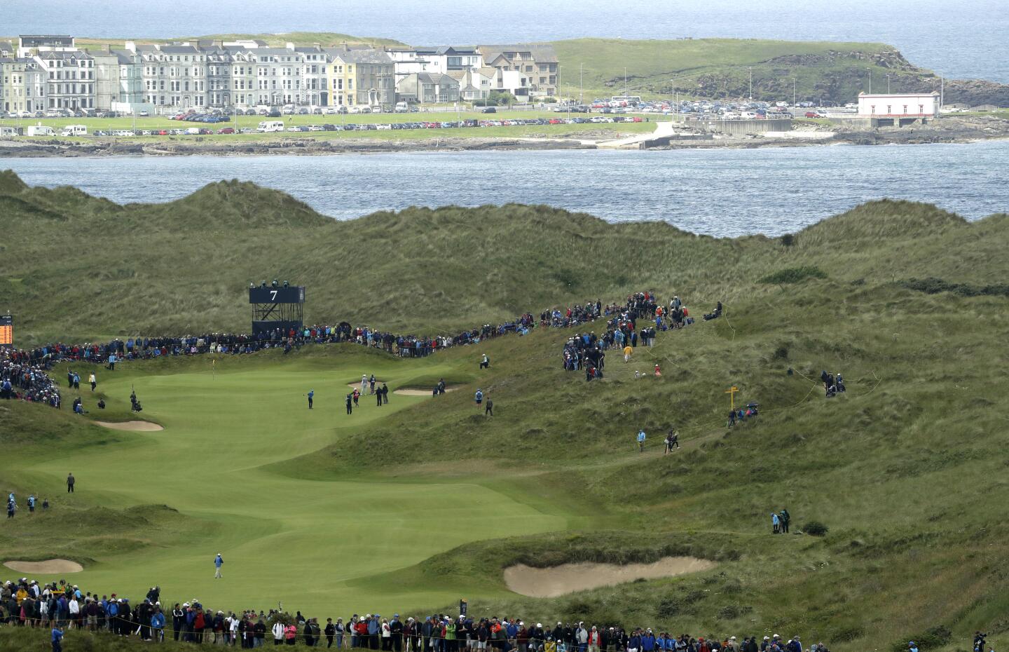 Players contend with the undulating, zigzagging seventh hole during the first round of the 148th Open Championship at Royal Portrush Golf Club in Northern Ireland.