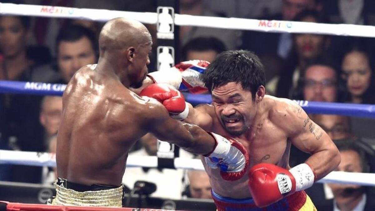 Floyd Mayweather Jr. and Manny Pacquiao trade blows during their fight in Las Vegas on May 2.