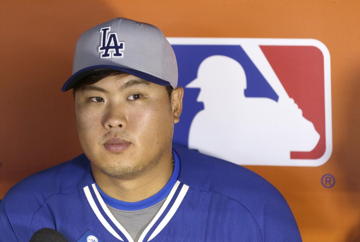 Dodgers starting pitcher Hyun-Jin Ryu addresses the media before a game Saturday in Miami.