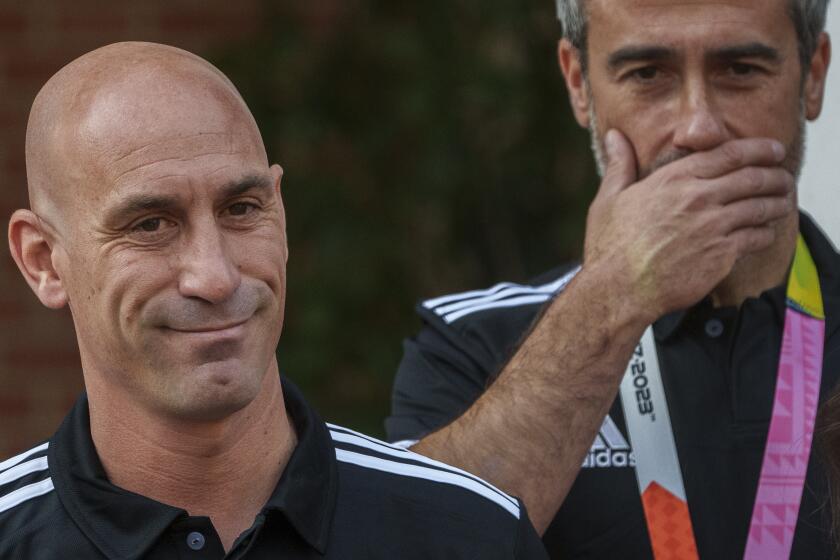 FILE - President of Spain's soccer federation, Luis Rubiales, left, stands stands next to Spain Head Coach Jorge Vilda after being received by Spain's Prime Minister Pedro Sanchez at La Moncloa Palace in Madrid, Spain, Tuesday, Aug. 22, 2023. Rubiales has resigned, Sunday, Sept. 10, 2023, from his post after a kiss scandal which tarnished Spain's victory at the Women's World Cup. (AP Photo/Manu Fernandez, file)