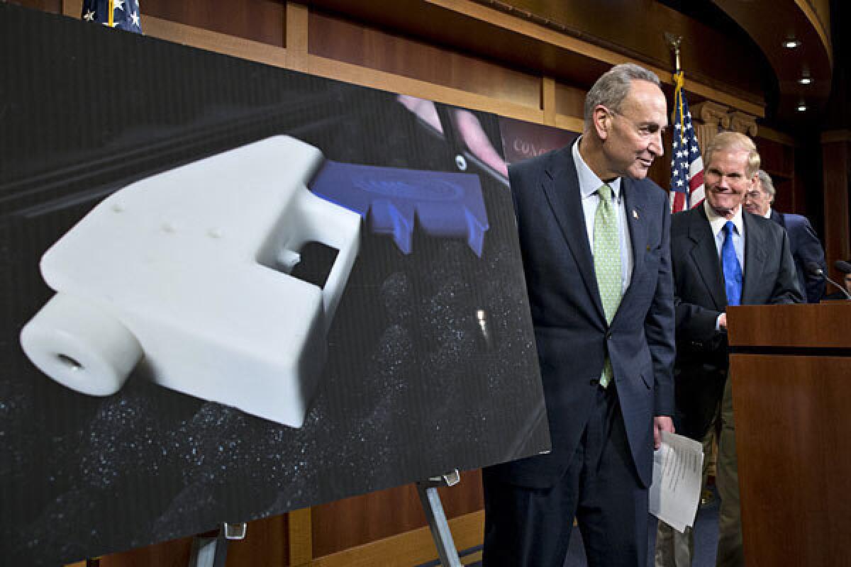 Sen. Charles E. Schumer (D-N.Y.), left, and Sen. Bill Nelson (D-Fla.) talk about their effort to renew the ban on plastic firearms Monday at the Capitol.