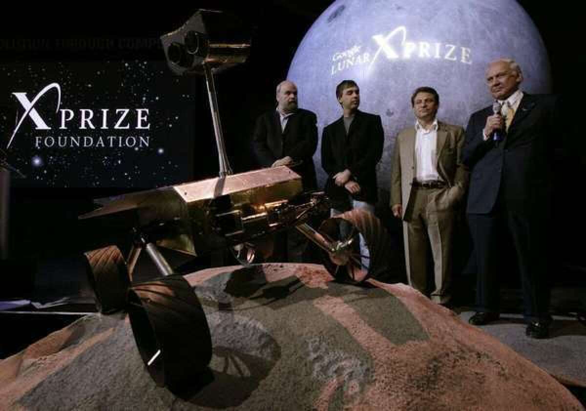X-Prize Chief Executive Peter Diamandis joined Apollo astronaut Buzz Aldrin on Sept. 13, 2007, when the prize foundation announced its Google Lunar X-Prize. On Thursday, Diamandis announced that the organization was calling off its $10-million Archon Genomics X-Prize competition, which had been set to begin Sept 5.