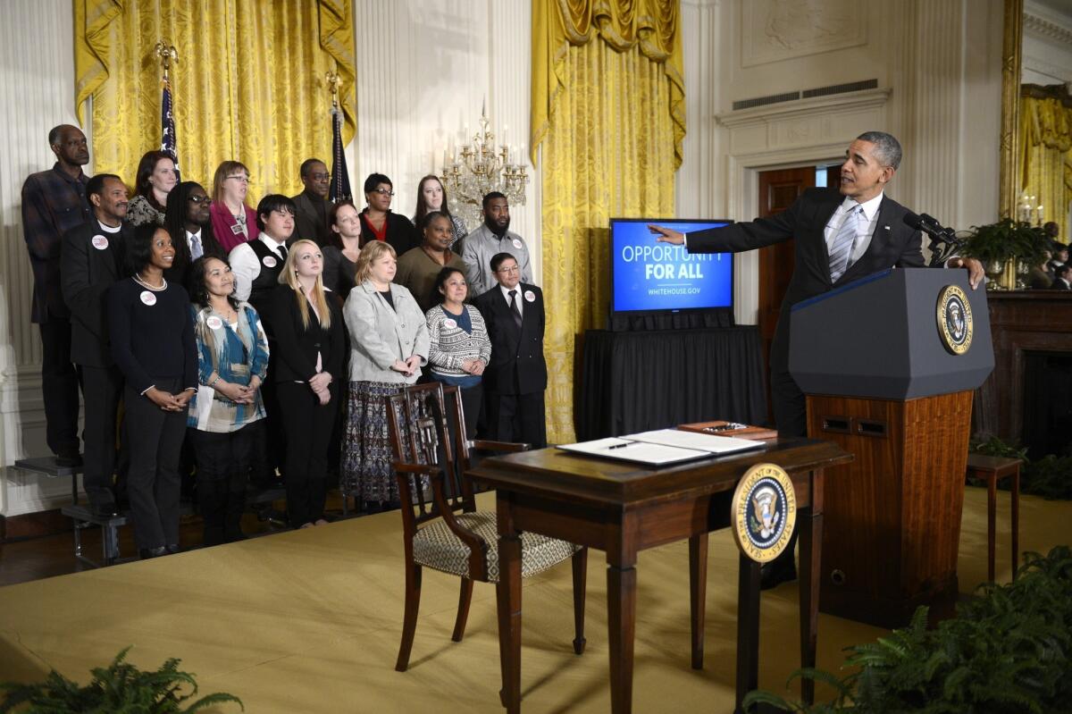 President Obama delivers remarks during a ceremony signing an executive order raising the minimum wage for federal contract workers.