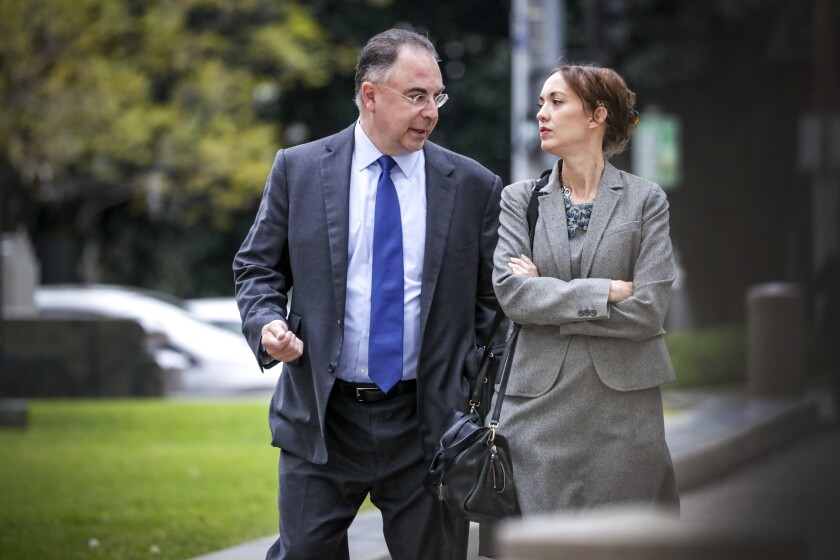 Paul Paradis, shown with attorney Angela Machala, outside L.A. County Superior Court in 2019.