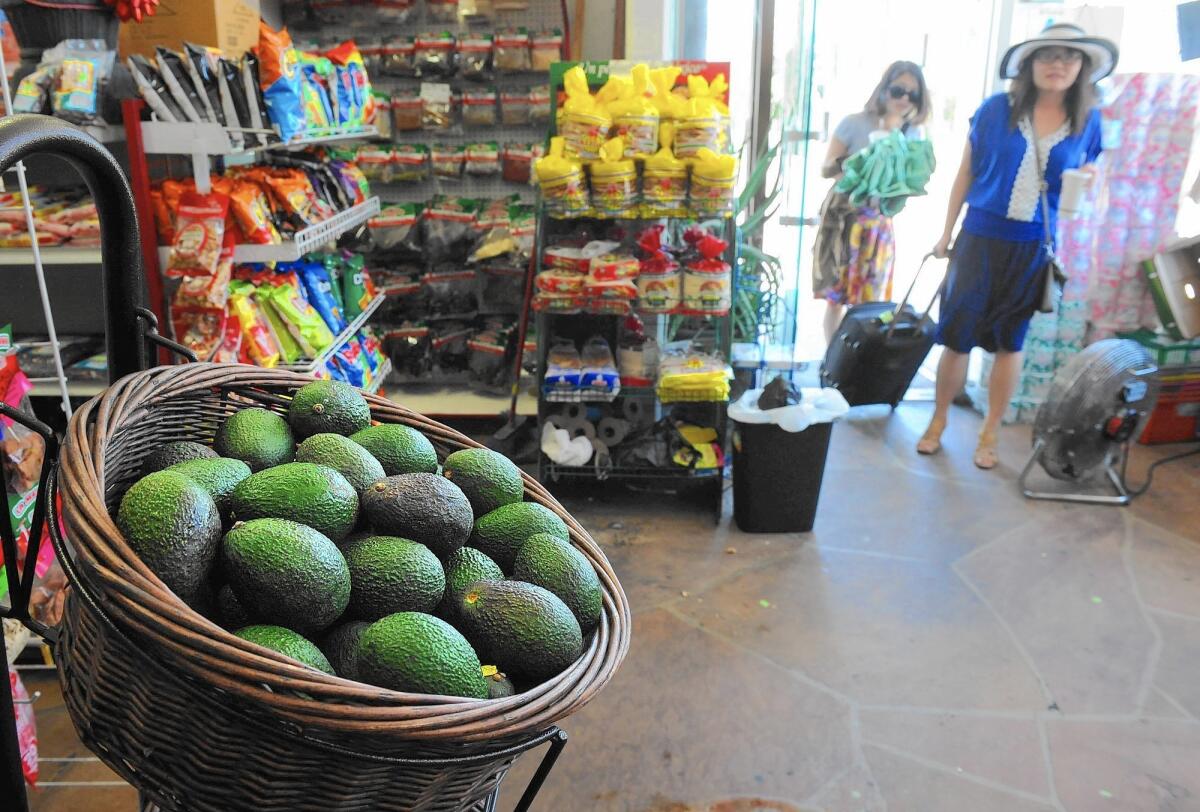 Avocados for sale at a corner store in L.A.'s Filipinotown; the neighborhood, long known as a food desert, is seeing an influx of more healthful fare.