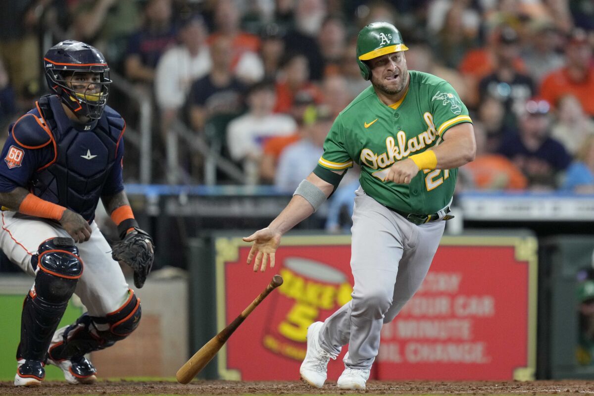 Oakland Athletics' Stephen Vogt hits a RBI single during the eighth inning of a baseball game against the Houston Astros, Sunday, July 17, 2022, in Houston. (AP Photo/Eric Christian Smith)