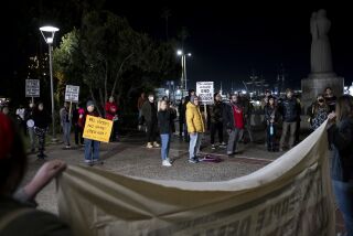 People listen to speakers at the Waterfront Park during the protest in San Diego, Calif. on Jan. 27, 2022, after the Memphis police release the bodycam footage of Nichols’s violent arrest.