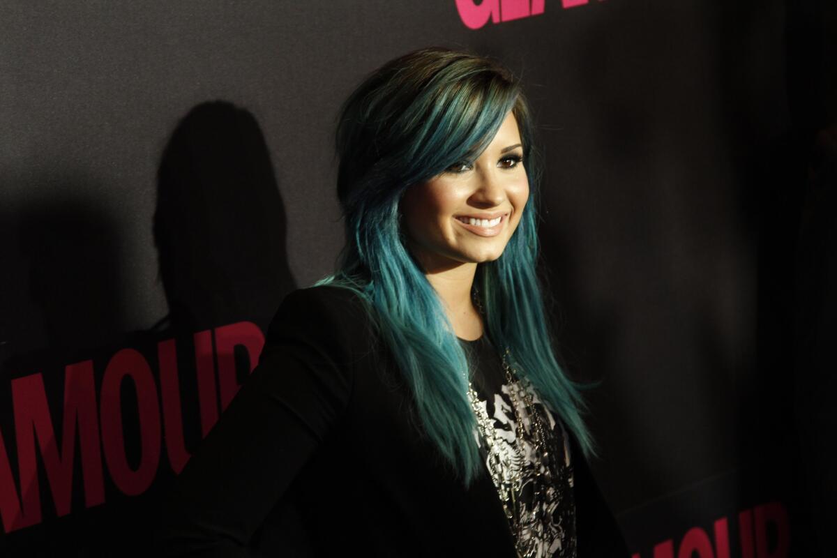 Demi Lovato said Wednesday that she is leaving "The X Factor" to focus on her music.