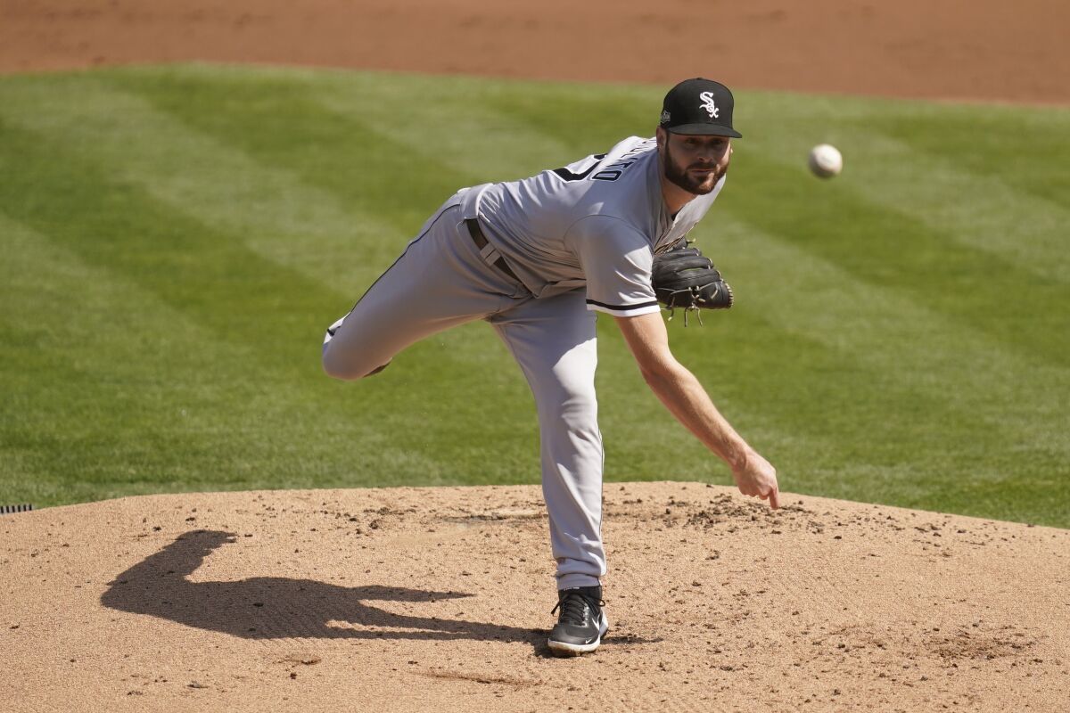 Chicago White Sox pitcher Lucas Giolito throws against the Oakland Athletics.