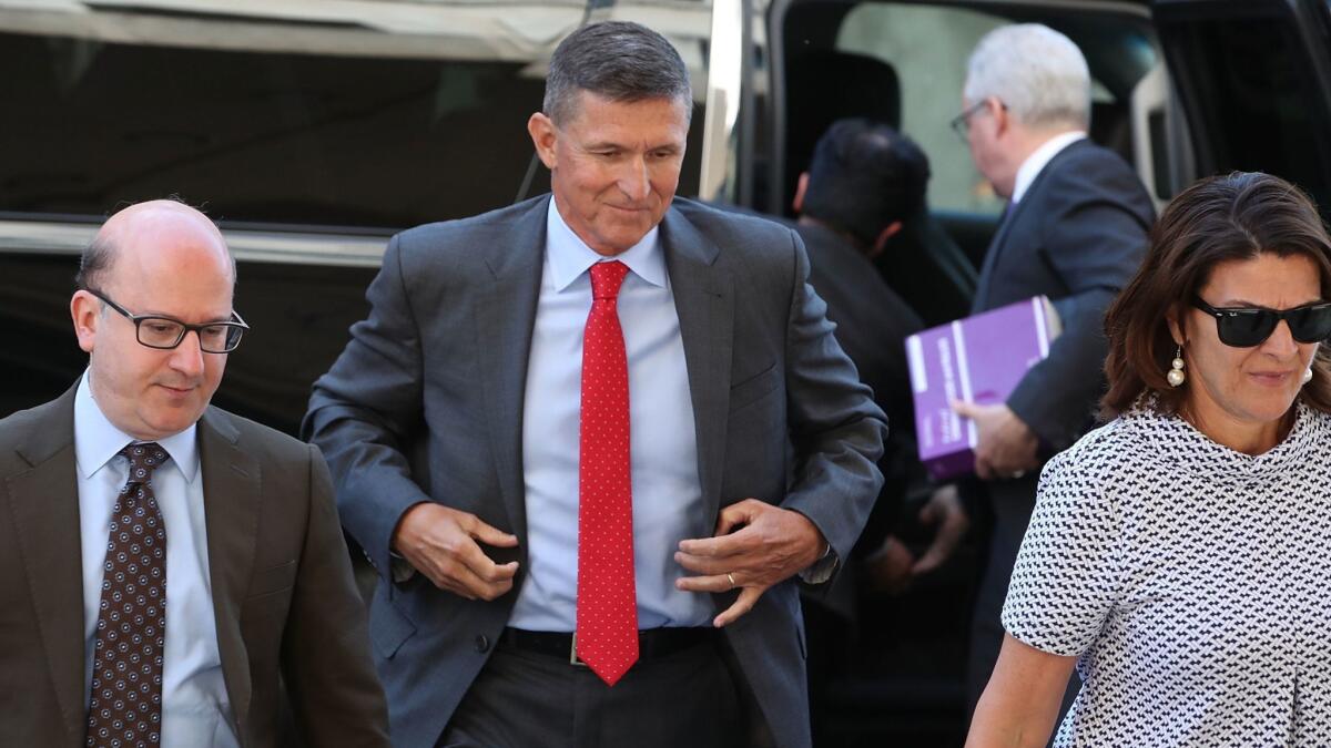 Michael Flynn, center, arrives at court in Washington in July.