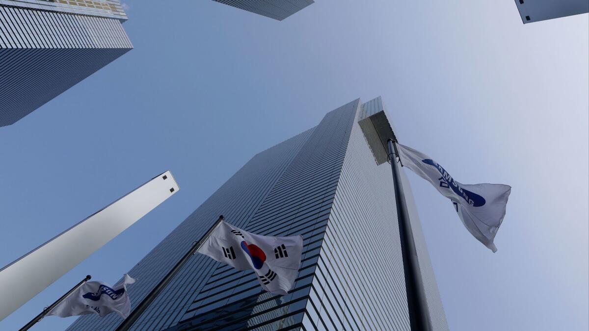 Flags fly outside Samsung headquarters in Seoul on Jan. 12.