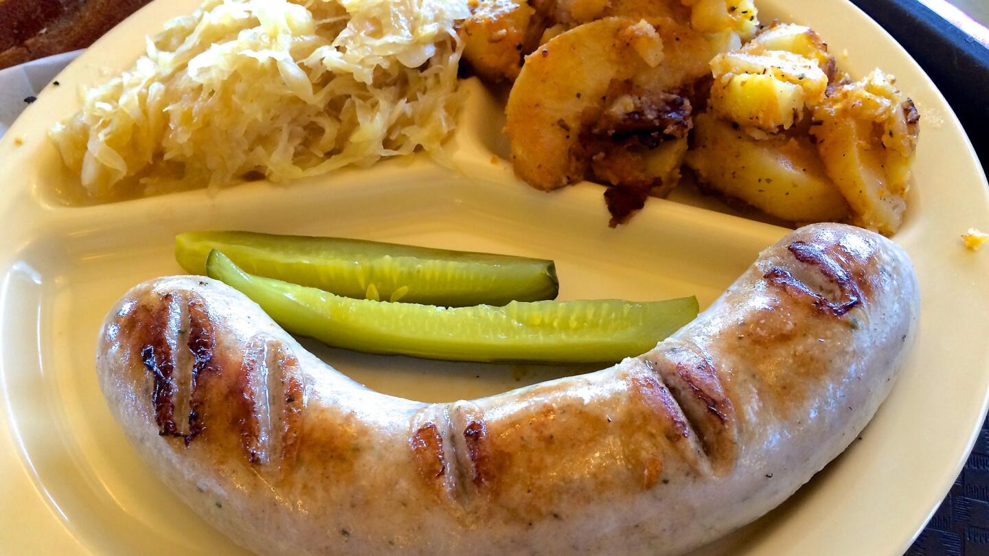 A juicy brat, good kraut and fried potatoes -- a working lunch at Alpine Village.