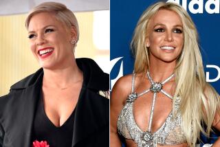 Separate pictures of singer Pink in a black outfit and Britney Spears in a strappy silver top