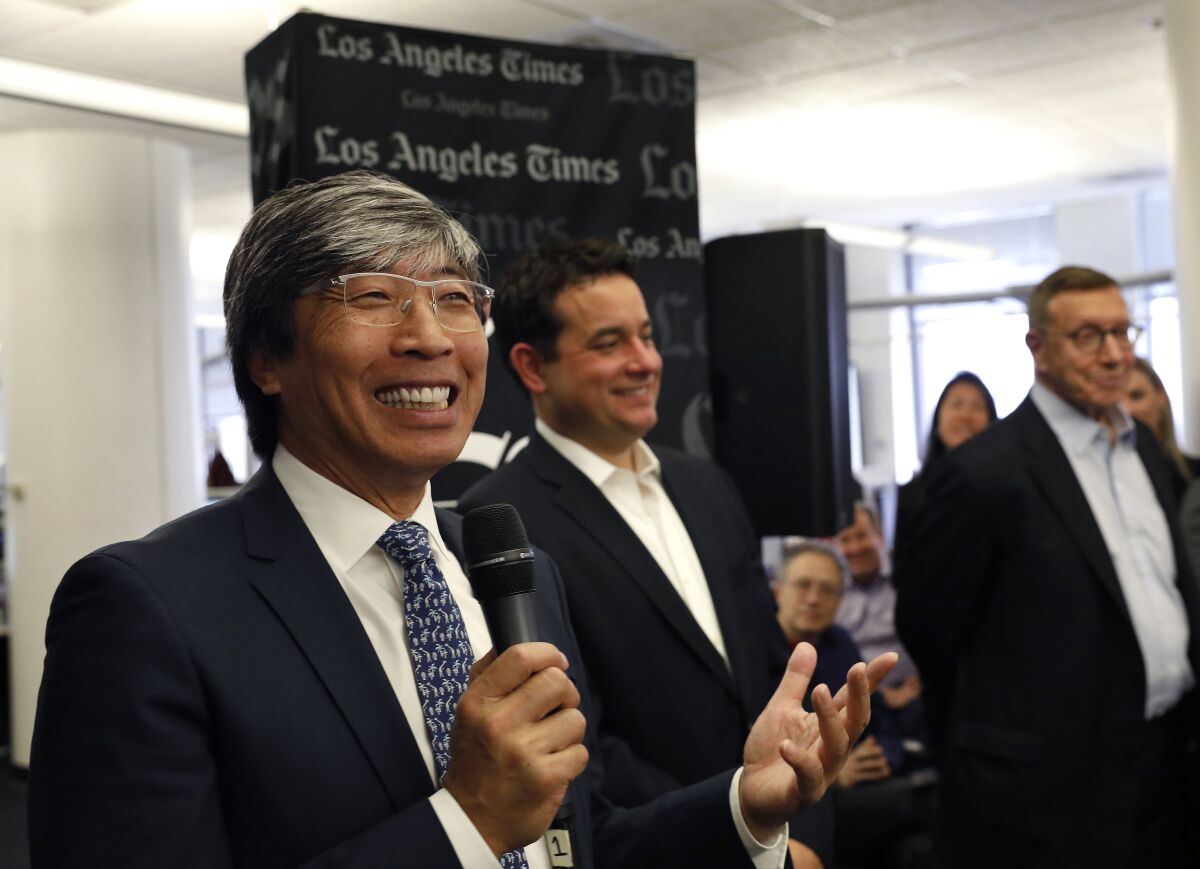 Patrick Soon-Shiong, from left, Chris Argentieri and Norm Pearlstine hold a town hall meeting with L.A. Times staff in 2018.