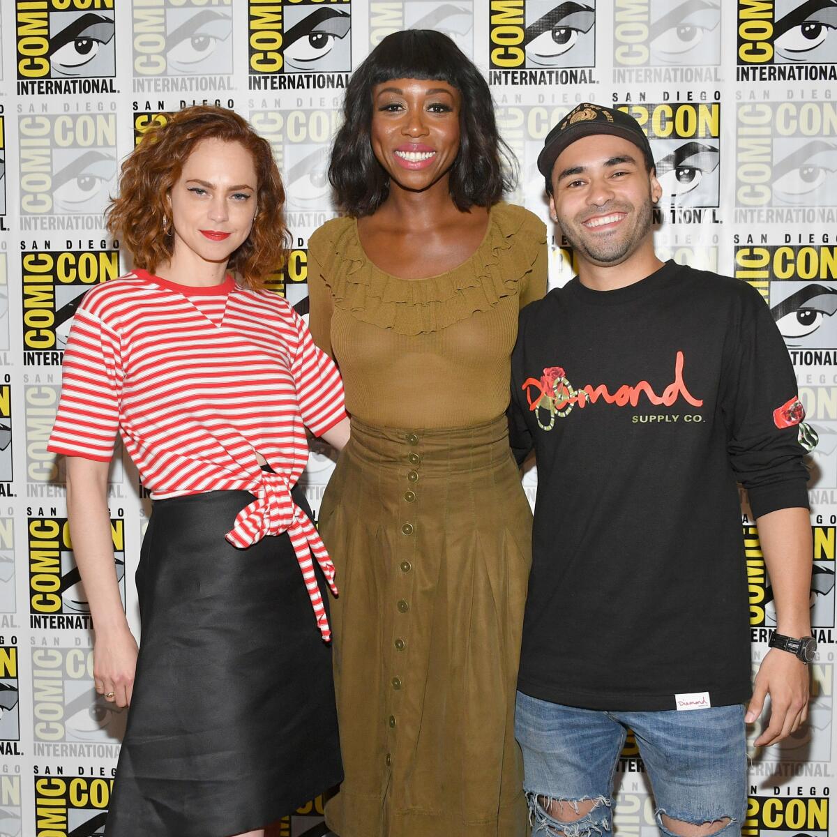 From left, Fiona Dourif, Amanda Warren and Gabriel Chavarria attend the "Purge" Press Line during Comic-Con International 2018.
