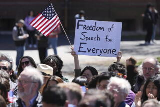 Students, faculty and members of the Harvard University community rally in Cambridge, Mass.