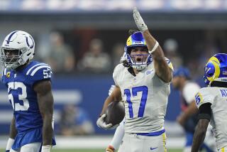 Rams receiver Puka Nacua (17) celebrates after a reception as Colts linebacker Shaquille Leonard looks on.