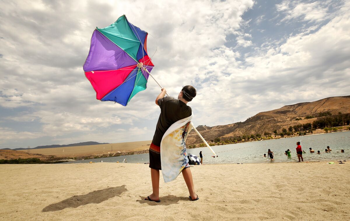 Zachary Pruett, 10, catches wind with this umbrella 