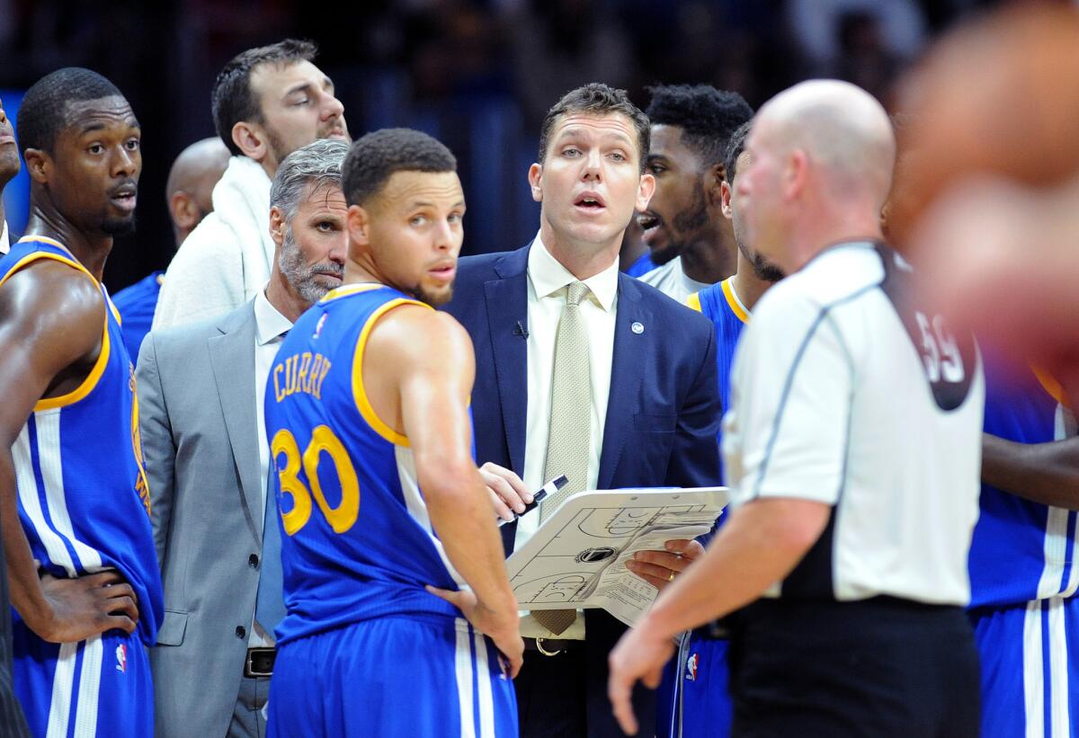 Warriors interim head coach Luke Walton waits for a referees call during a timeout against the Clippers at the Staples Center on Nov. 19, 2015.