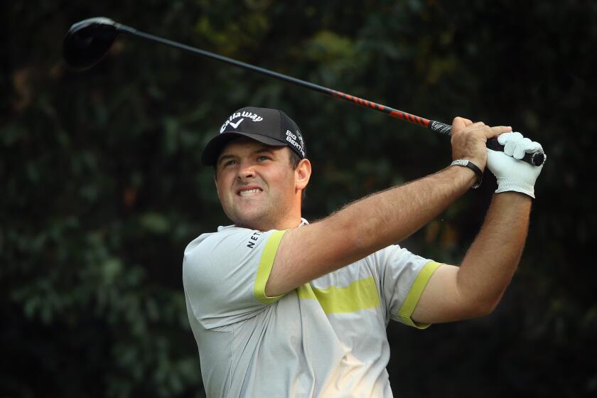 Patrick Reed hits his tee shot on the fifth hole Thursday during the HSBC Champions at the Sheshan International Golf Club in Shanghai.
