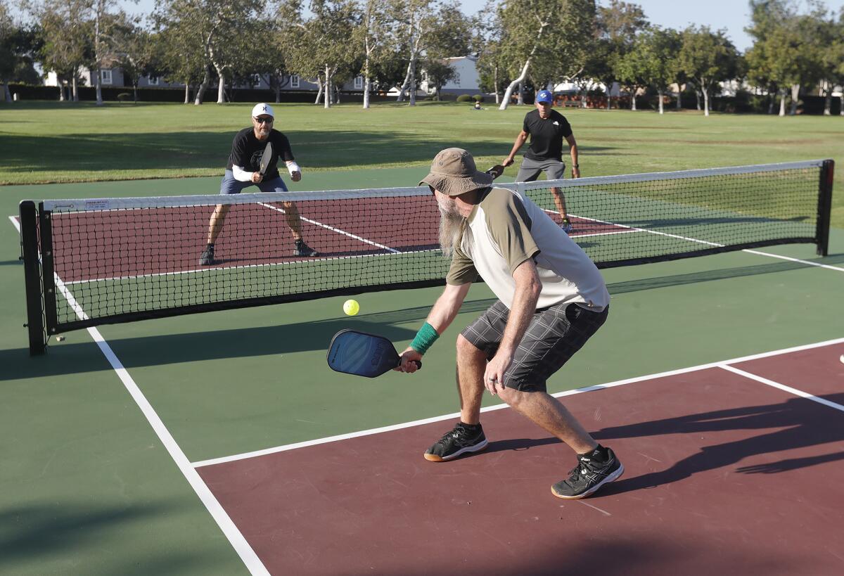 Players take to the new pickleball courts at Tanager Park in Costa Mesa.