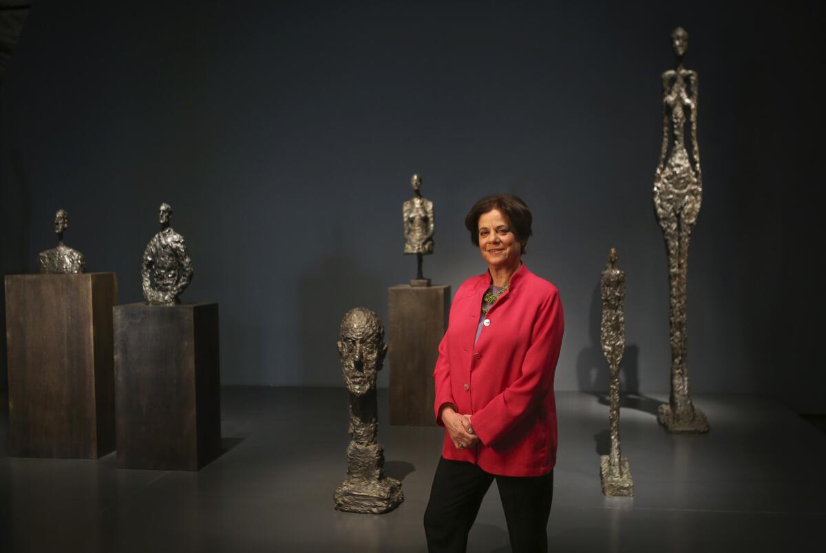 Stephanie Barron, Senior Curator Modern Art Department Head at the Los Angeles County Museum of Art in Los Angeles, is photographed in front of bronze sculptures by Alberto Giacometti on exhibit at the museum on March 12, 2015. Barron is one of the most long-running staffers, having been at the museum since 1976.