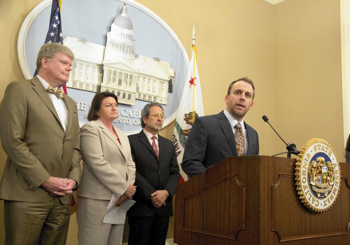 Assemblyman Marc Levine, right, discusses a bill to change the lobbying rules for the Coastal Commission. With him are co-authors Assemblyman Mark Stone, left, and Assembly Speaker Toni Atkins.