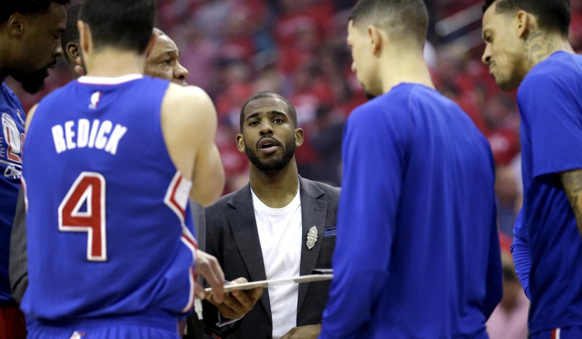 Chris Paul, center, stands with Clippers teammates before Game 2 on Wednesday in Houston.