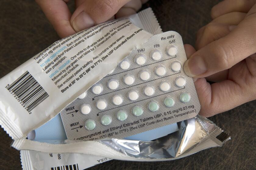 FILE - A one-month dosage of hormonal birth control pills is displayed in Sacramento, Calif., Aug. 26, 2016. A drug company is seeking U.S. approval for the first-ever birth control pill that women could buy without a prescription. The request from a French drugmaker sets up a high-stakes decision for the Food and Drug Administration amid the political fallout from the Supreme Court's recent decision overturning Roe v. Wade. (AP Photo/Rich Pedroncelli, File)
