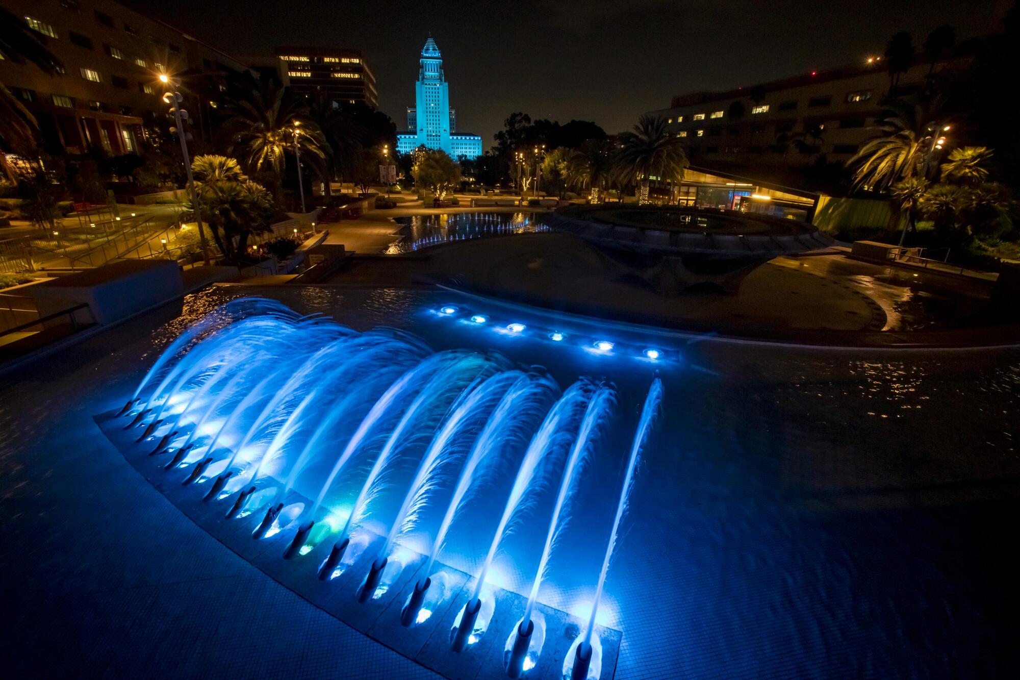 City Hall and the fountain at Grand Park are lit up for Vin Scully.