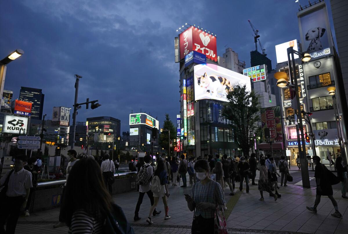 Pedestrians in Tokyo on July 30, 2021. The capital is under a state of emergency to prevent spread of COVID-19.