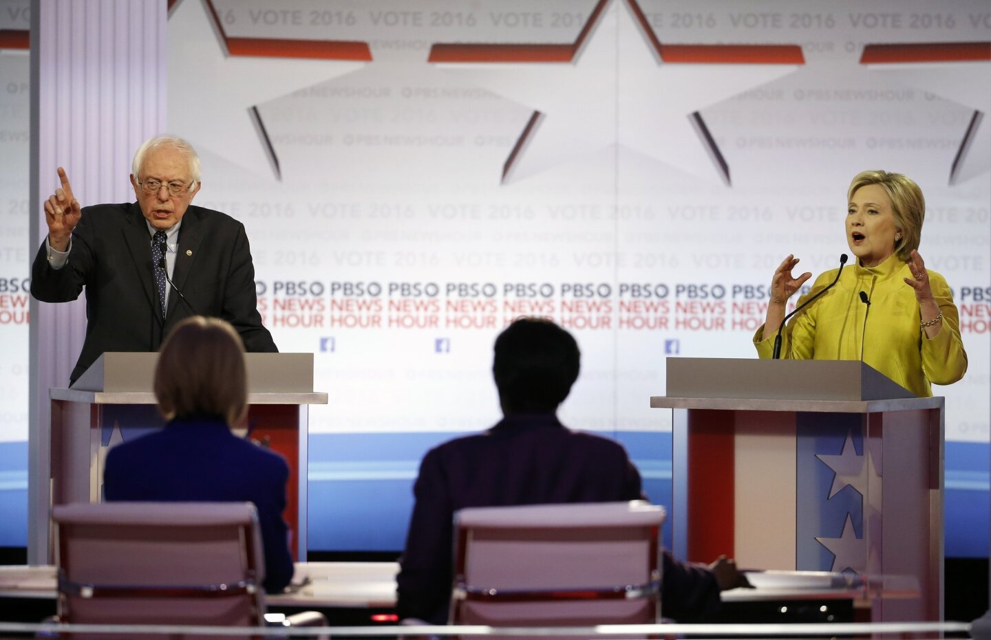 Candidates Sen. Bernie Sanders and Hillary Clinton argue a point during the Democratic presidential primary debate at the University of Wisconsin-Milwaukee.