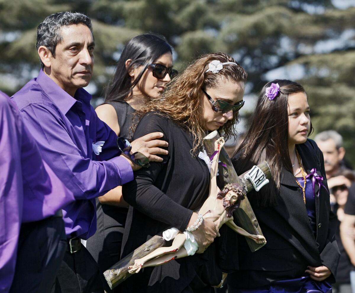 Malena Santana, center, mother to 19-year-old Burbank resident Sugey Cuevas, along with other relatives, arrive for funeral services at Pierce Brothers Vahalla in Los Angeles on Tuesday, Oct. 8, 2013. Cuevas was one of five people who died in a fiery crash in Burbank on September 28, 2013.