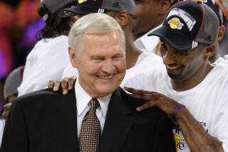 FILE - Los Angeles Lakers' Kobe Bryant gives basketball great Jerry West a shoulder rub after the Lakers beat the San Antonio Spurs 100-92 in Game 5 of the NBA Western Conference basketball finals, May 29, 2008, in Los Angeles. (AP Photo/Kevork Djansezian, File)