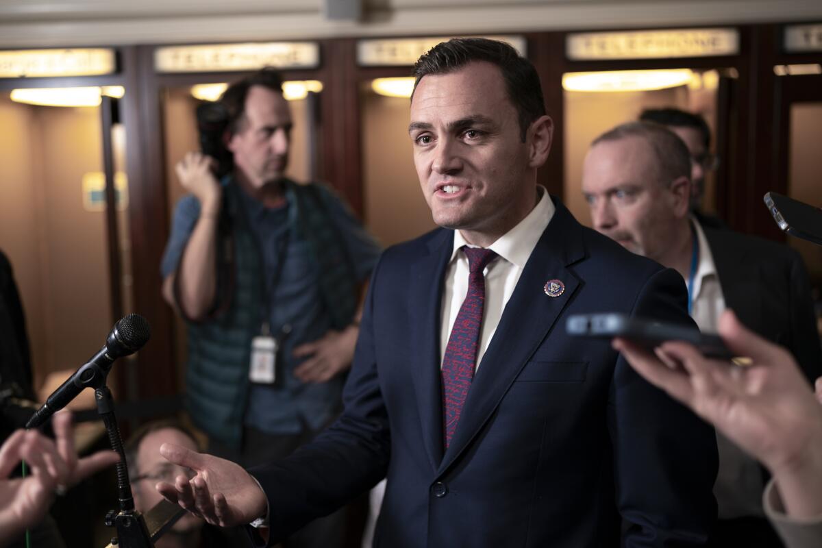 Rep. Mike Gallagher speaks to reporters.