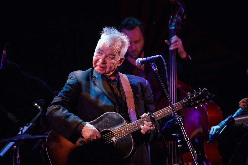 John Prine performs live during a tribute to John Prine at The Troubadour on Saturday, February 9, 2019 in West Hollywood, Calif. Prine was honored during the annual pre-Grammy Awards gathering of the Americana Music Association. (Patrick T. Fallon/ For The Los Angeles Times)