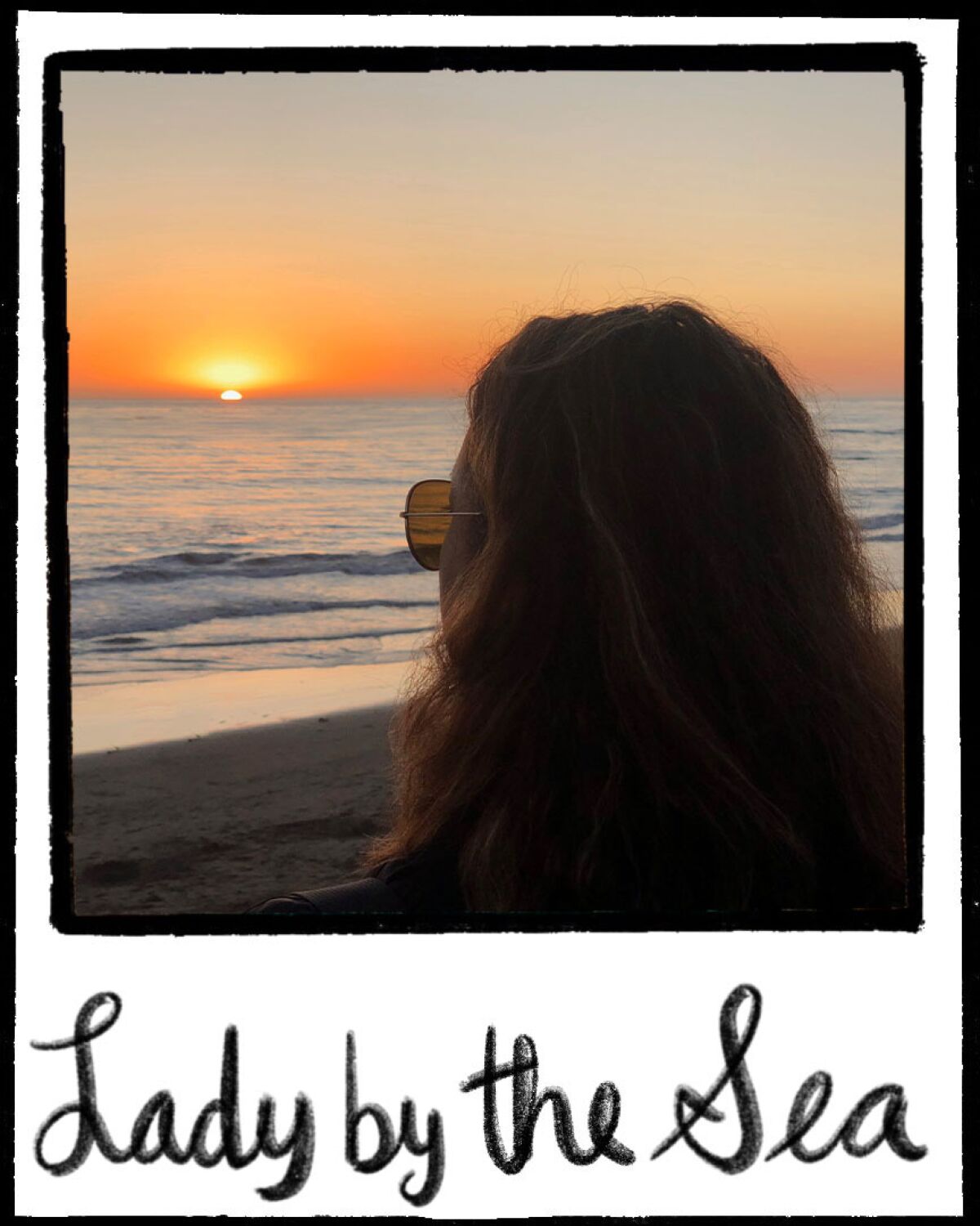 Illustrated polaroid frame with a photo of a woman looking at a beach sunset. 'Lady by the Sea' is written at bottom of frame