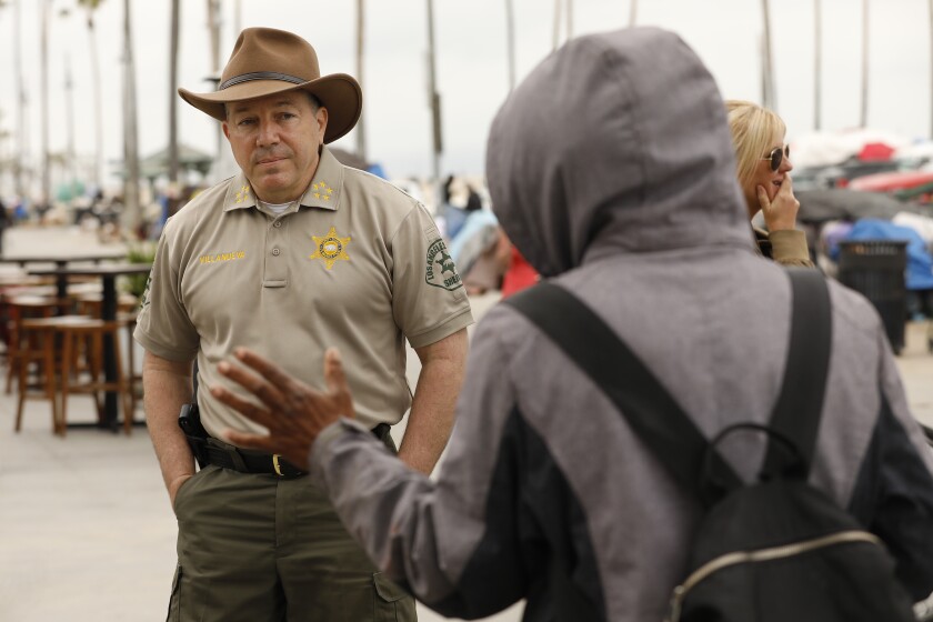 LOS ANGELES, CA - JUNE 07: Los Angeles County Sheriff Alex Villanueva talks with media, homeless advocates and local residents as he walked the Venice Boardwalk. He railed about the failures of local elected officials