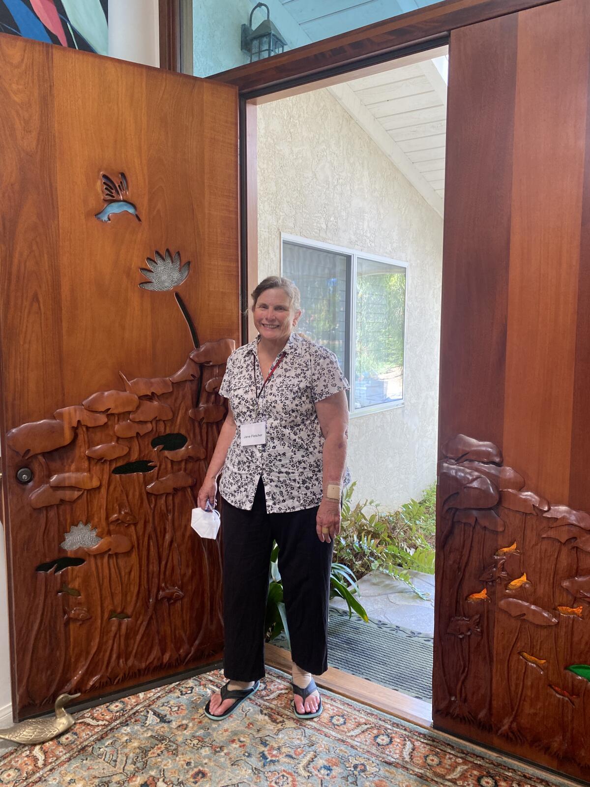 La Jolla artist Jane Fletcher shows her front doors, which she carved.