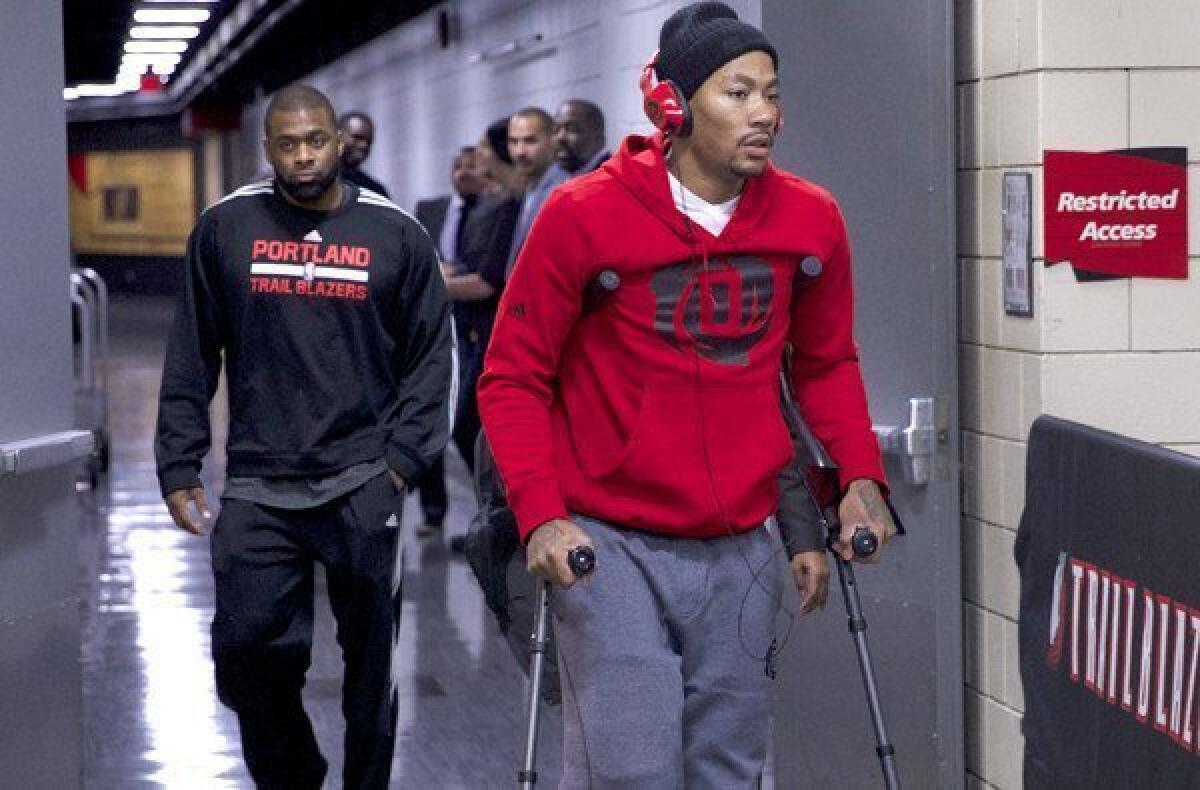 Bulls point guard Derrick Rose leaves the Moda Center in Portland on crutches after he was injured in the game against the Trail Blazers on Friday night.