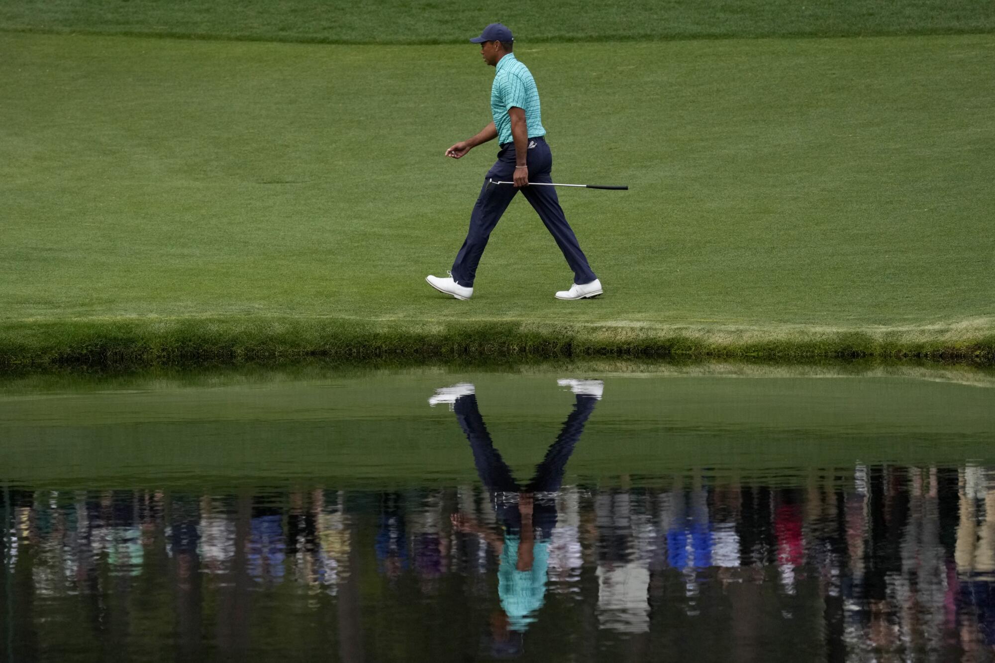 Tiger Woods walks along the 16th fairway during the second round.