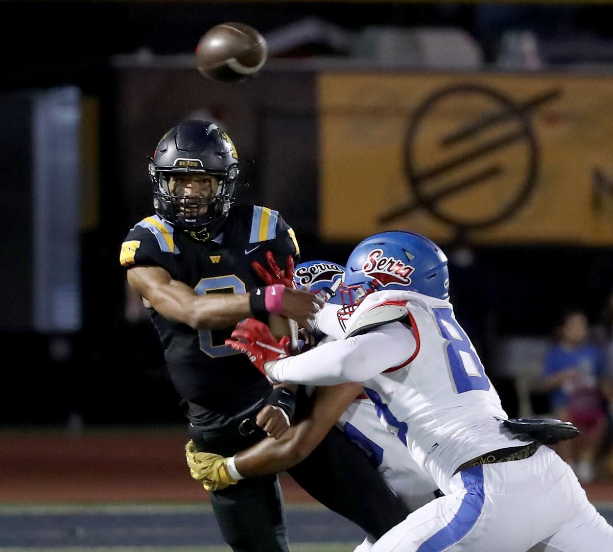 Warren quarterback Nicholaus Iamaleava throws under pressure.