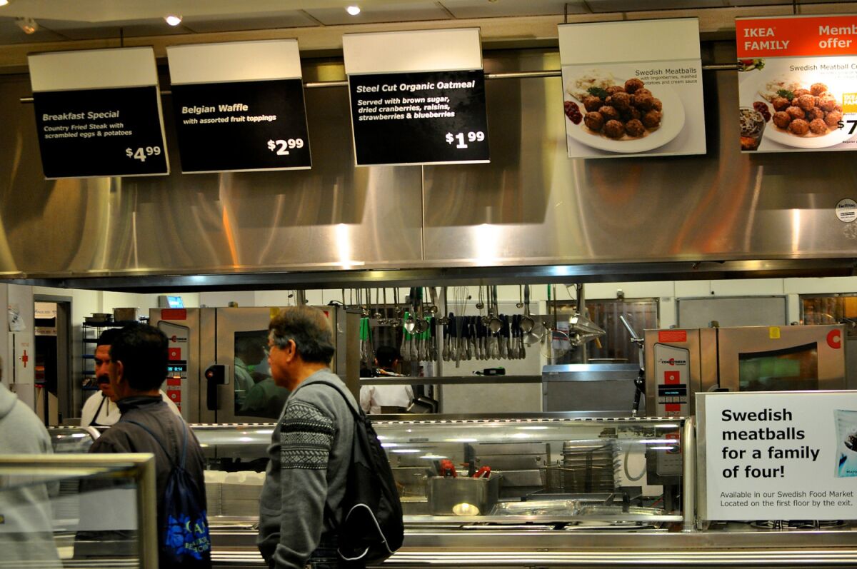Diners wait in line at a restaurant inside an Ikea store.