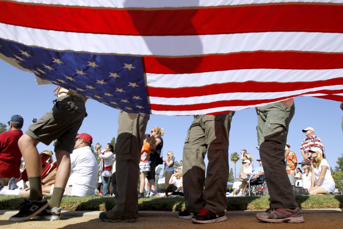 Local boys scouts prepare to raise the U.S. flag during Memorial Day Service at Memorial Park in La Canada Flintridge on Monday, May 26, 2014.